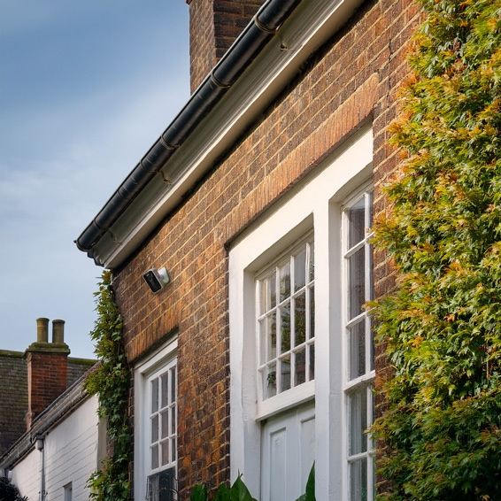 Front of a house showing the Yale Smart Outdoor Camera