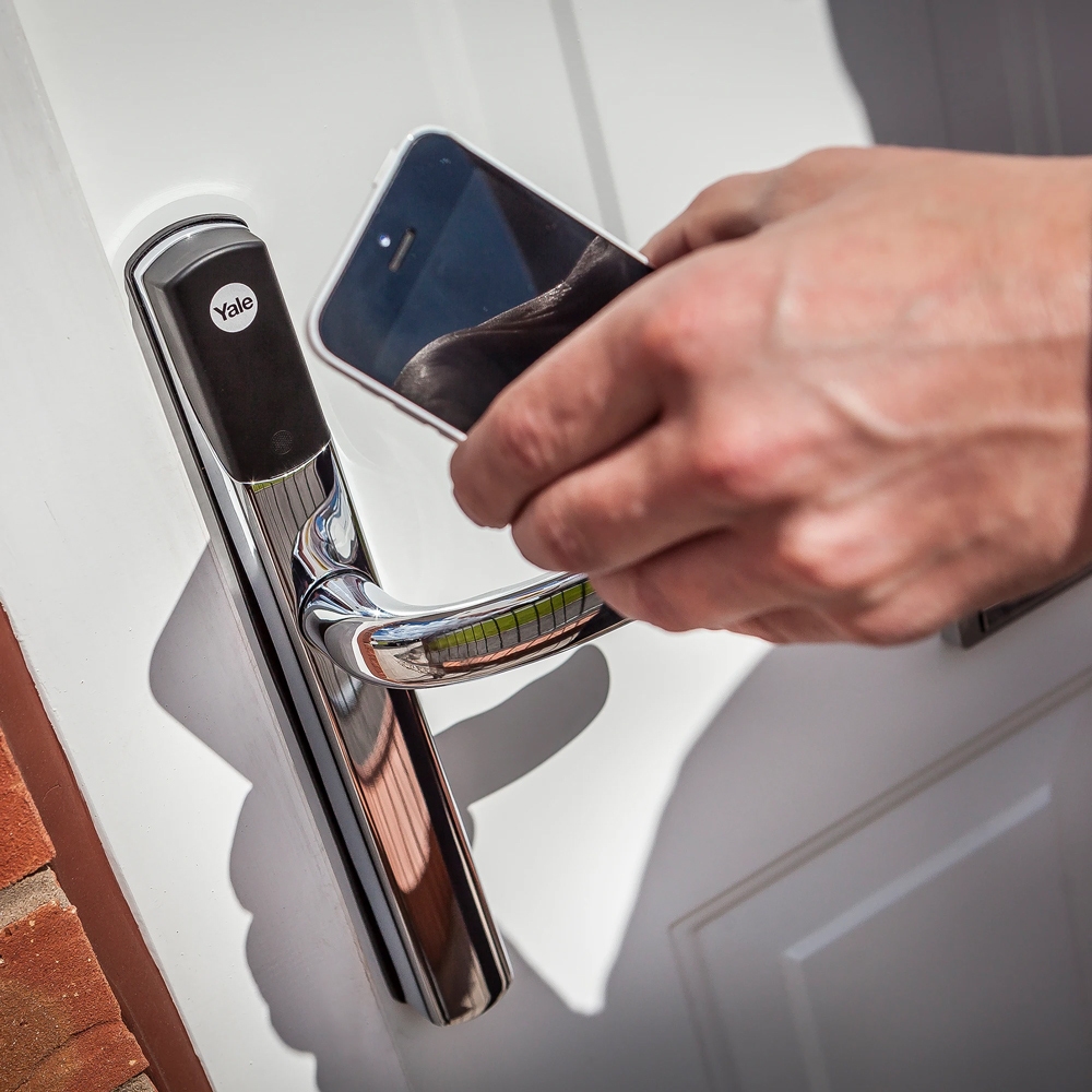 Women checking the status of her front door using the Yale Home App